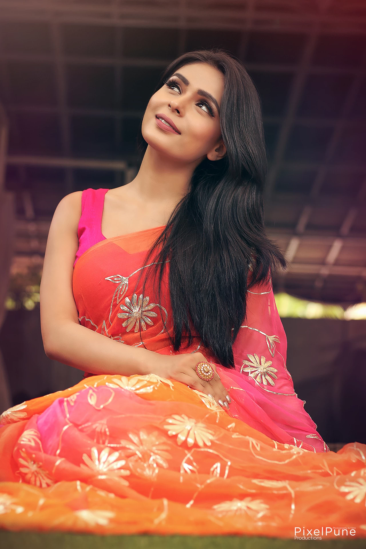 Sonal Vengurlekar shoot in orange pink saree